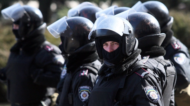Police officers stand guard in front of the regional state administration building in Donetsk earlier this week