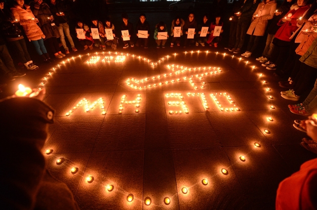 College students holding a candlelight vigil for the passengers on the missing Malaysia Airlines airliner MH370 in Yangzhou, Jiangsu province, China (Pic: EPA)