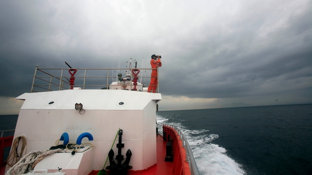 Indonesian Search and Rescue personnel keep a lookout on a rescue ship in the Indian Ocean, near the tip of Sumatra Island (Pic: EPA)