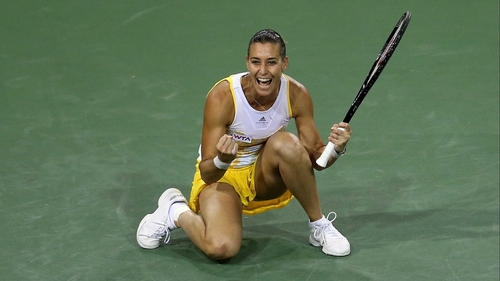 Flavia Pennetta celebrates after winning match point