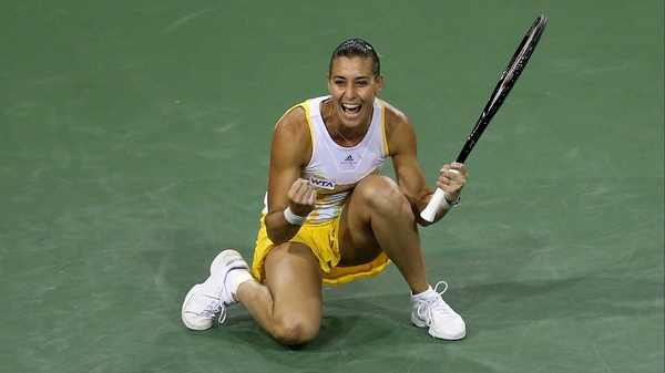 Flavia Pennetta celebrates after winning match point