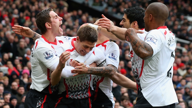 Steven Gerrard is mobbed following one of his two successful penalties