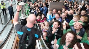 O'Connell displays the trophy to the delighted crowd at Dublin Airport