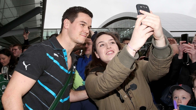 Jonathan Sexton poses for a 'selfie' with a fan