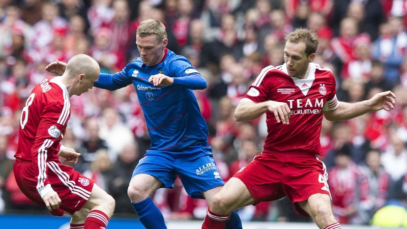 Willo Flood, left, in action in the Scottish League Cup