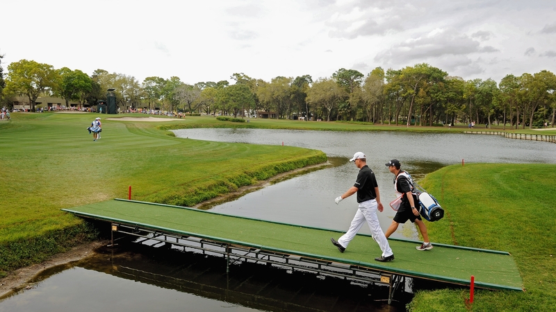 John Senden crosses a bridge on the 12th fairway during his final round