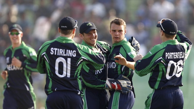 Andy McBrine celebrates with Paul Stirling and William Porterfield