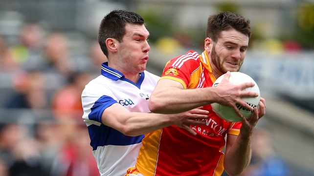 Gerard McDonagh and Michael Concarr battle for the ball