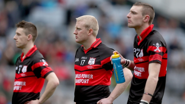 Mount Leinster Rangers look on dejected as Portumna celebrate
