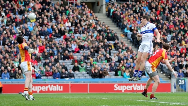Diarmuid Connolly rises highest to score a goal