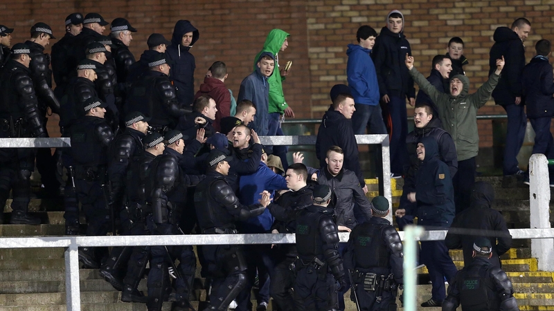 Police stand between supporters at The Oval