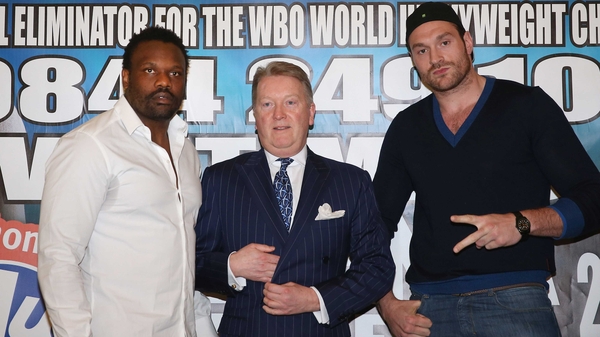 Dereck Chisora (left) and Tyson Fury (right) pose with promoter Frank Warren