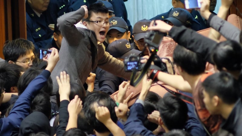 The protesters are opposed to moves by the government to pass a trade pact with China