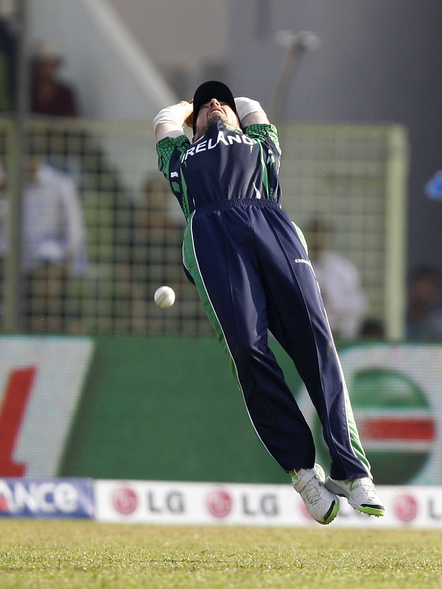Ireland's Max Sorensen attempts a catch against Zimbabwe