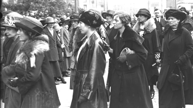 Cathal Brugha's funeral. Cumann na mBan women hold hands for crowd control. Caitlin Brugha and Muriel MacSwiney are pictured in the centre. Mary MacSwiney is on the far right (Pic: RTÉ Stills Library)