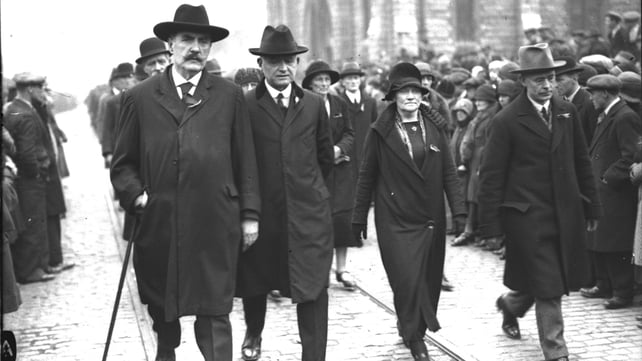 Mary MacSwiney marches between Pierce O'Mahony, John Joseph Kelly and Brian O'Higgins at the funeral of Cathal Brugha (Pic: RTÉ Stills Library)
