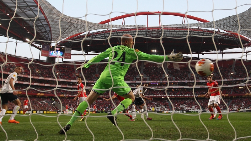 Ezequiel Garay of Benfica heads his side's opening goal past Brad Friedel