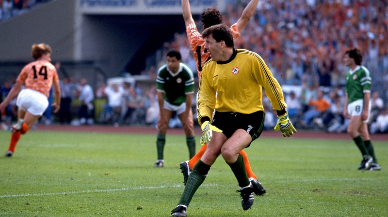 Wim Kieft (no. 14) turns to celebrate his goal as Packie Bonner looks on in Gelsenkirchen at Euro '88