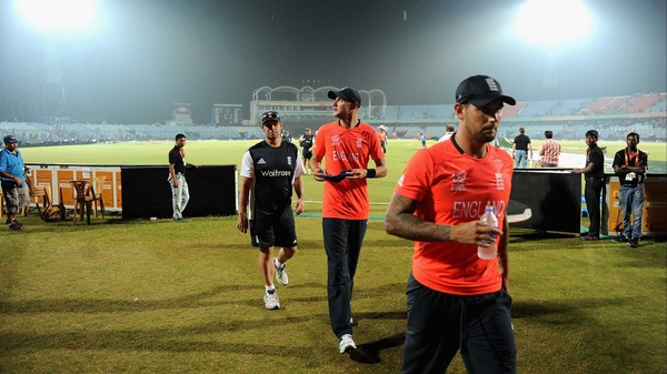 England captain Stuart Broad and Jade Dernbach leave the field as second rain shower stops play