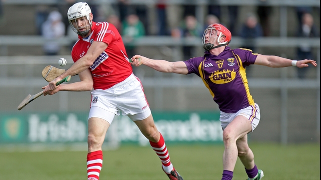 Willie Devereux strains to hook Cork's Patrick Cronin