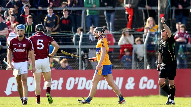 Referee Diarmuid Kirwan issues Shane Golden with a straight red card in Clare's clash with Galway