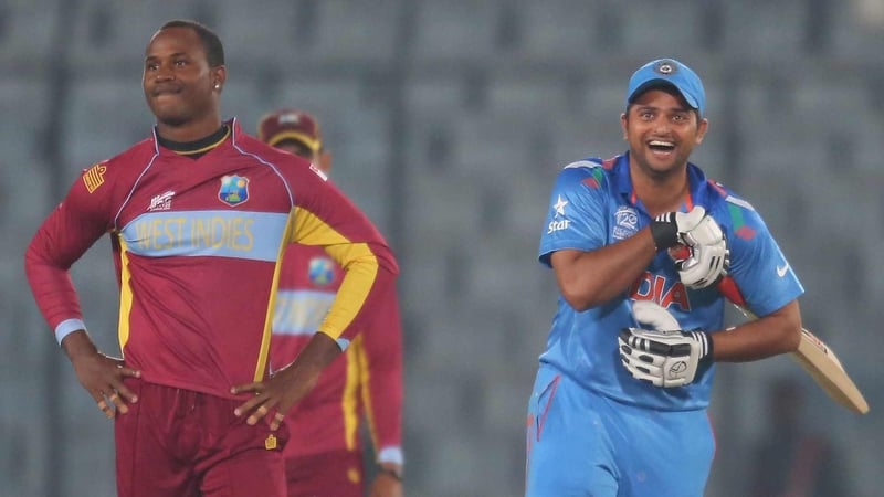 Suresh Raina (R) after hitting the winning runs for India