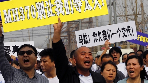 Relatives express their anger outside Malaysia's embassy
in Beijing