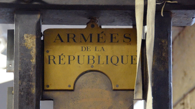 The blade of the guillotine bears the inscription "Armees de la Republique"