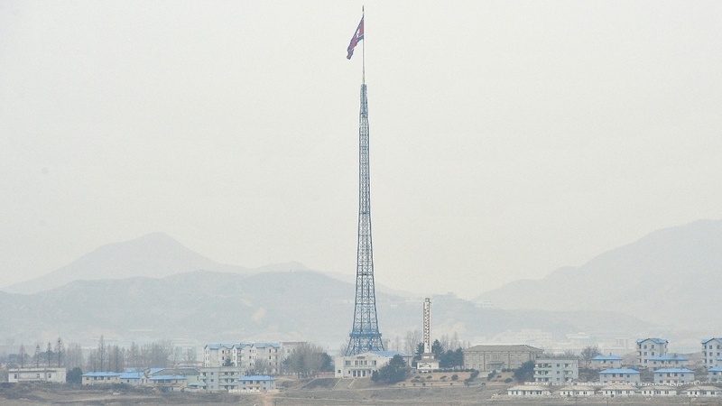 A North Korean flag flutters in the propaganda village of Gijungdong