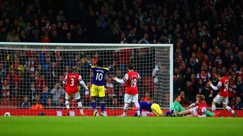 Swansea's Wilfried Bony celebrates as Mathieu Flamini of Arsenal scores an own goal to make it 2-2