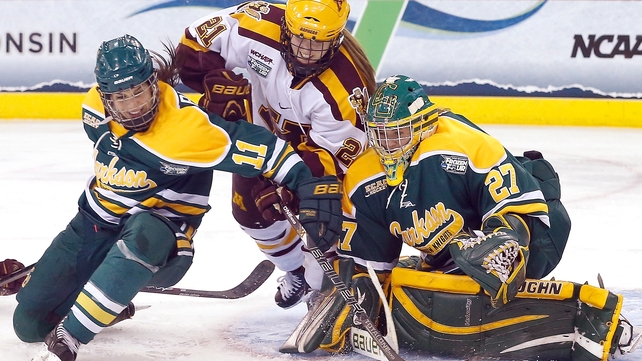 The Minnesota Golden Gophers and the Clarkson Golden Knights contest the puck during the Women's Ice Hockey Championship in Connecticut