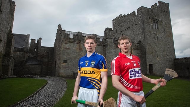 Hurlers Brendan Maher of Tipperary and Cork's Lorcan McLoughlin pose at a photoshoot at Cahir Castle ahead of the Allianz Hurling League quarter-final tie