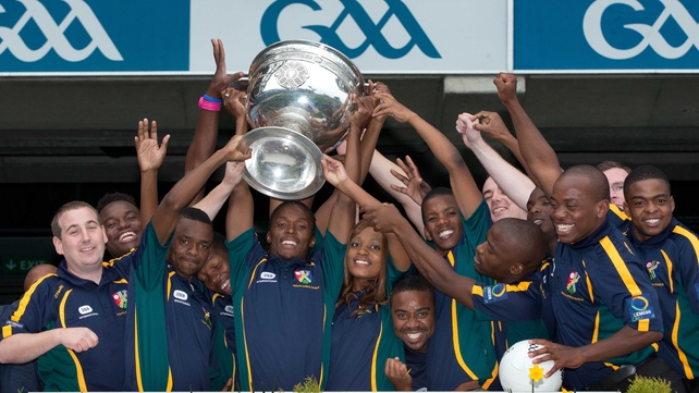 South African Gaels players in Croke Park with the Sam Maguire trophy