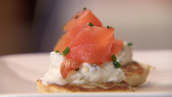 Smoked salmon belini with caper and chive crème fr