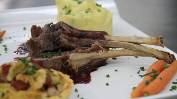 Roast rack of lamb served with a cabbage, bacon &