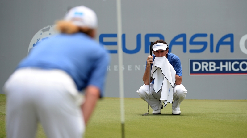 Gonzalo Fernandez-Castano lines up his putt on the 18th green