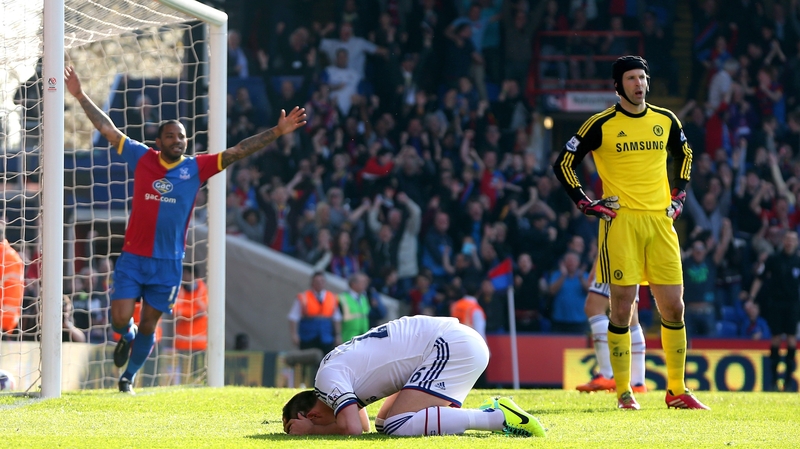 A dejected John Terry (c) reacts after scoring an own goal to give Palace the lead
