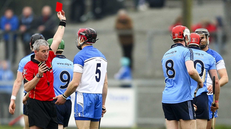 Referee Johnny Ryan shows Waterford's Shane O'Sullivan a red card