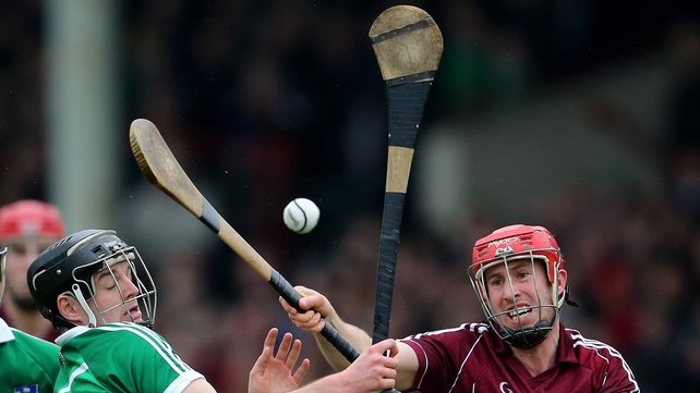 Limerick's Alan Dempsey and Niall Healy of Galway compete for a ball in the air