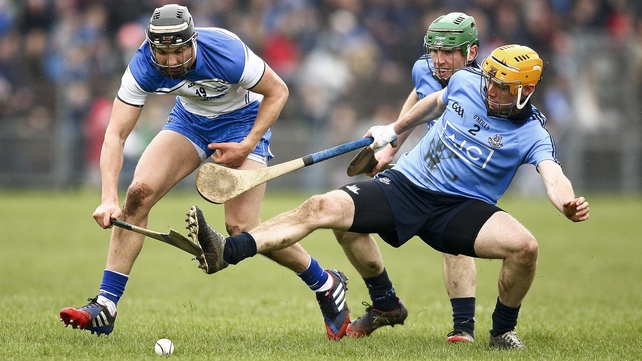 Darragh Fives of Waterford competes with Dublin's Paul Chute
