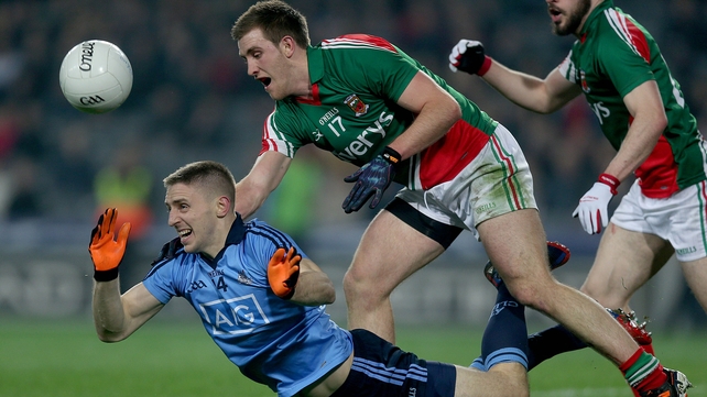 Eoghan O'Gara of Dublin falls under the tackle of Shane McHale