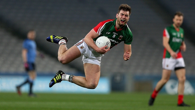 Mayo's Aidan O'Shea feels the effects of a tackle from a player who is out of shot