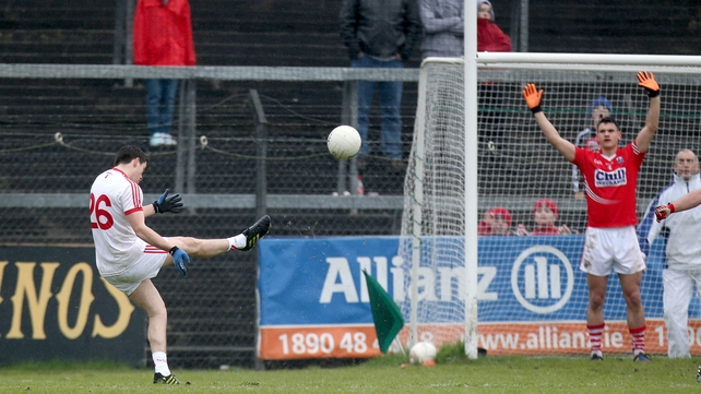 Ronan O'Neill kicks the equalising free in the last minute for Tyrone against Cork