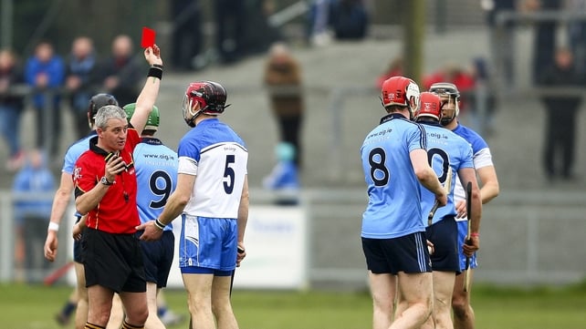 Referee Johnny Ryan shows Waterford's Shane O'Sullivan a red card