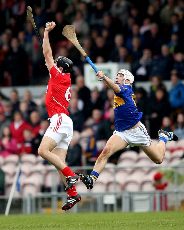 Christopher Joyce of Cork and Niall O’Meara compete for the ball