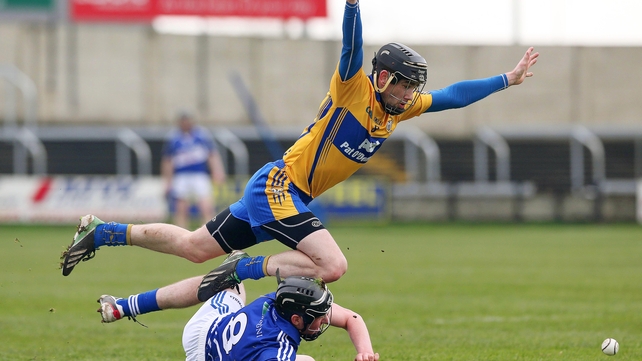 Patrick Donnellan of Clare soars above Laois' Paddy Purcell