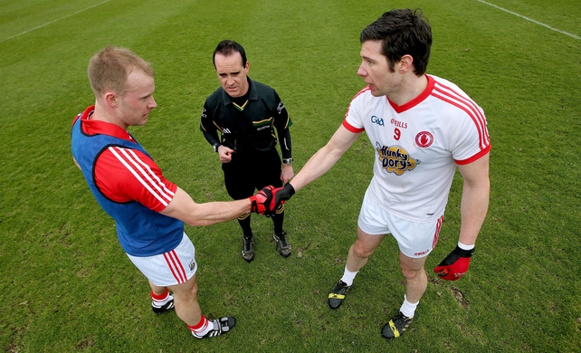 Michael Shields and Sean Cavanagh with referee David Coldrick at the coin toss