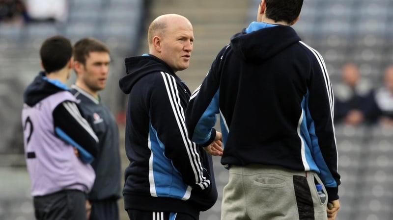 Michael Carruth acts as a masseur to Anthony Daly's side