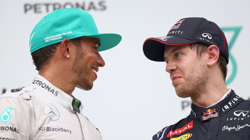 Sebastian Vettel (r) on the podium in Malaysia last Sunday with winner Lewis Hamilton