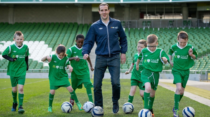 John O'Shea with children from Corduff FC at the launch of the FAI's Future Football 2014 initiative at the Aviva stadium